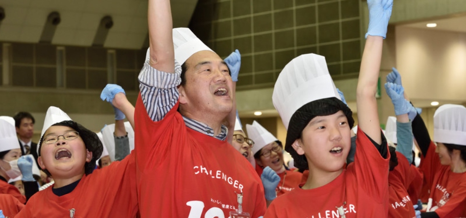 people in chef hats making desserts