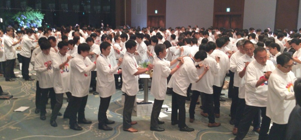 people signing shirts