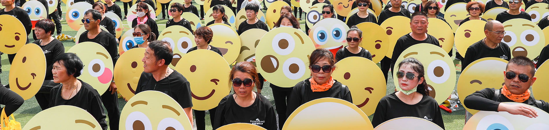 people holding emojis