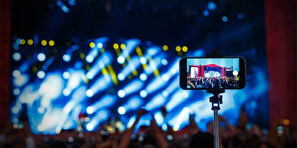 Mobile phone shown streaming a live event