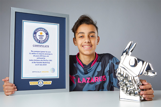 Jaden with GWR certificate and Fortnite trophy
