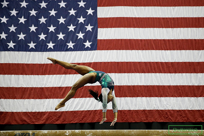 Simone executing a double double dismount on beam