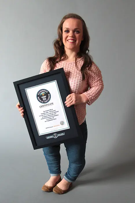 Ellie with certificate smiling