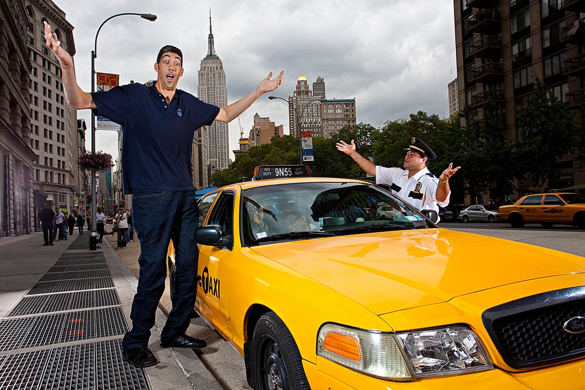 Sultan takes part in a photoshoot next to taxi for the Guinness World Records book