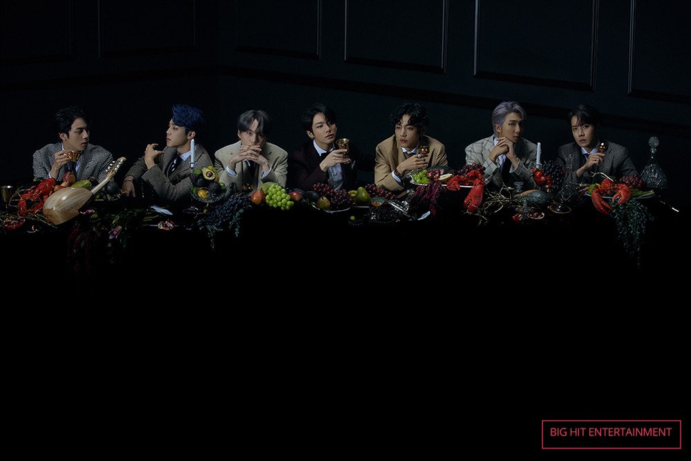 BTS at a table eating fruit