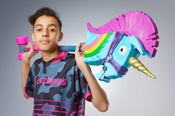 Jaden Ashman holding a toy unicorn pickaxe 