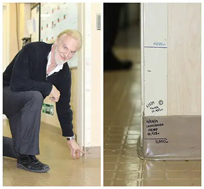 Victor marks off his dives on the door frame of the command centre on board the ship