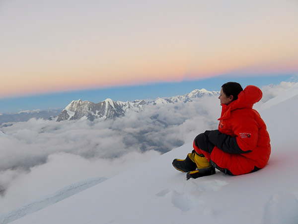 Viridiana enjoying the scenery from the top of Mount Manaslu, Nepal